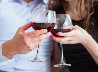 Young pair drinking wine in romantic concept