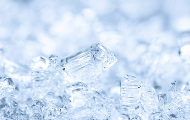 Naklejka na ściany i meble Broken ice cubes, winter background, texture of ice crystals. Frozen water.
