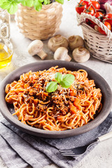 Spaghetti bolognese with mushrooms and cheese. Italian cuisine