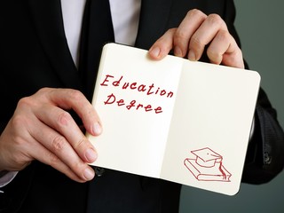 Business concept about Education Degree with inscription on the sheet.