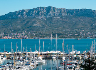 Small marina harbour with sailboats and yachts seen from above. Anchored near "Marjan" hill in split, croatia