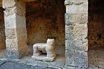 A unique find in the ruins of the Mayan-Jaguar throne. This is a jaguar carved from stone. This is the throne for the ruler, a symbol of strength and power. Near the columns with ancient drawings.
