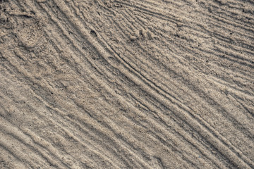 Rough gray surface of weathered plaster and cement