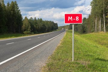 Information road sign with a number on the M8 in the Vologda region