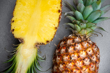 Ripe pineapple on grey background, isolated tropical fruit