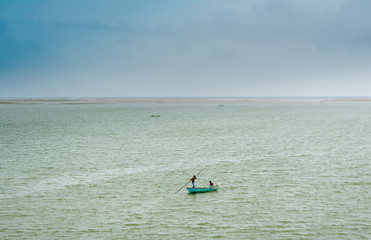 Sunshine pouring over the sea  through the clouds view from beach of somnath temple Gujarat India
