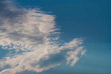 cloud as a brush trace on a blue sky