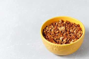 Oatmeal cereal granola bowl on ligth grey background