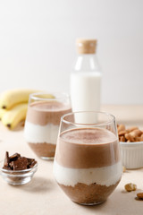 Chia seeds pudding with chocolate and banana smoothie in a glass
