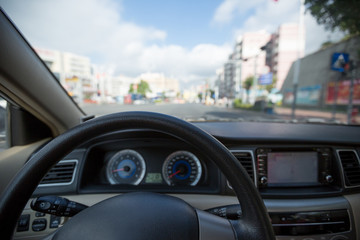 Waiting in front of the zebra crossing while driving car on city road