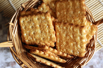 Time to drink tea and coffee break. A lot of square cookies with sesame seeds.