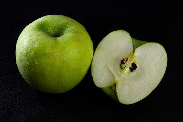 granny smith apple on black