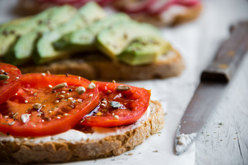 Vegetable sandwiches with radish, avocado and tomato, healthy vegan snack