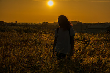 Silhouette Of A Woman With A Sunset In The Countryside