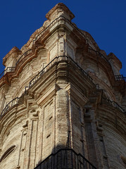 Detail of Baroque bell tower of the Church of San Juan Bautista in the old city center of Malaga. Spain.    