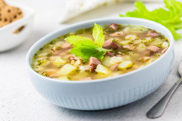 Pasta stars sausage soup. Selective focus, copy space.
