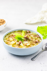 Pasta stars sausage soup. Selective focus, copy space.