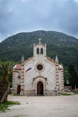 Fototapeta na wymiar Church in front of the mountain, in Ston, Dubrovnik Neretva county, located on the Peljesac peninsula, Croatia, Europe.