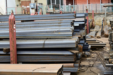 Photo of piles of pallets outdoors black metal lie