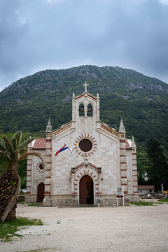 Church in front of the mountain, in Ston, Dubrovnik Neretva county, located on the Peljesac peninsula, Croatia, Europe.