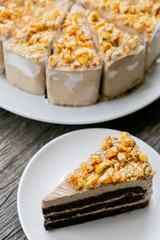 coffee caramel cake and on wooden background