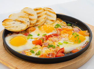 fried eggs with bacon and toast