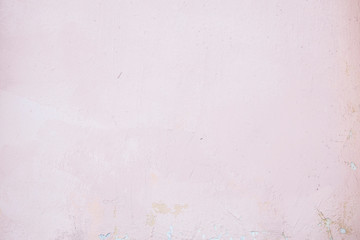 Pink concrete wall with chipped and scratches. Aged texture and background
