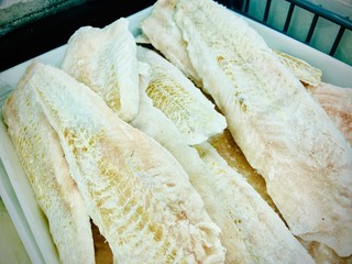 Fish and seafood in a supermarket. Close-up. Mobile photo.