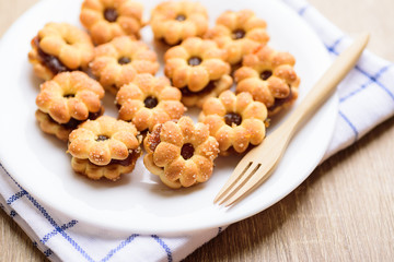 Cracker with pineapple jam (flower shape) on plate ready to eating, Thai snack	