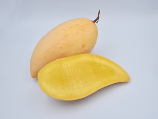 Ripe mangoes on white background