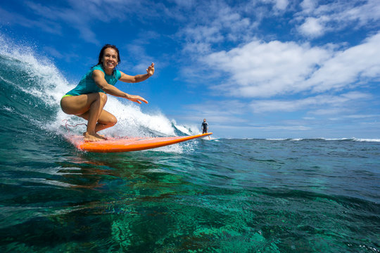 Beautiful Girl Surfing On Big Transparent Waves