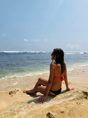 Fototapeta na wymiar Young woman enjoying summertime in the ocean / sea water.