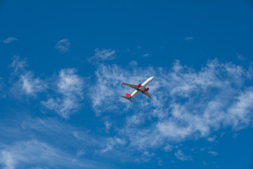 Large passenger plane flying in the blue sky. Fuerteventura, Canary islands, Spain. October 2019