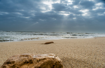 Sunshine pouring over the sea  through the clouds view from beach of somnath temple Gujarat India
