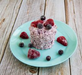 Carrot cake with curd cream and black currant