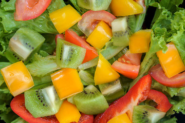 top view mix fruit and vegetable salad on black dish