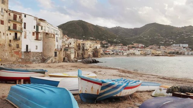 Wooden fishing boats on the old beach of Cefalu, Sicily, Italy