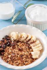 Healthy and delicious breakfast, granola with bananas and yogurt