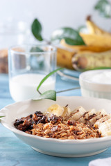 Healthy and delicious breakfast, granola with bananas and yogurt