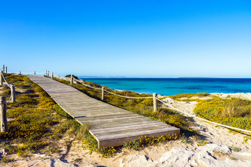 Wooden walkway in Ses Illetes beach, Formentera, Baleraic Islands / Spain