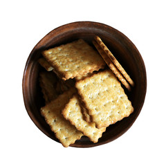 Delicious square cookies in a brown plate isolated on white background, top view