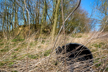 Plastic waste on a covered landfill in northwest Germany