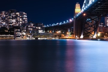 Fototapeta na wymiar Sydney Harbour Bridge long night exposure showing the vibrant colours of the lights on the water