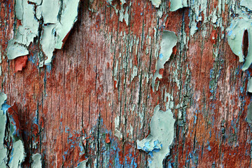 background of old blue and red paint on a wooden board macro