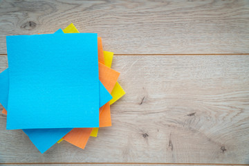  Kitchen rags and sponges on a wooden background