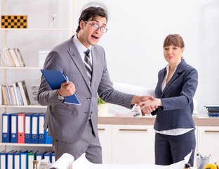 Man and woman discussing construction project