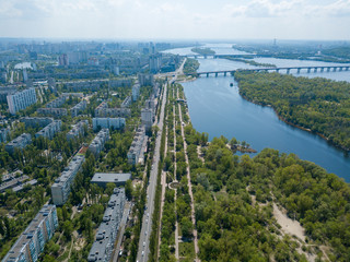 Housing estate in Kiev on the banks of the Dnieper River. Sunny spring day. Aerial drone view.