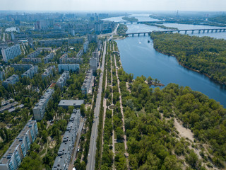 Housing estate in Kiev on the banks of the Dnieper River. Sunny spring day. Aerial drone view.