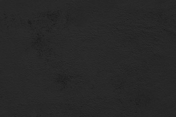 Black abstract background. Black stucco wall of an old house.