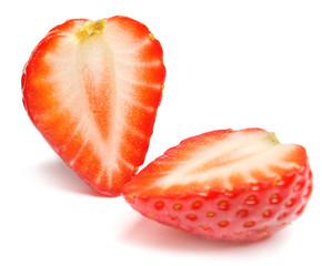 Strawberry. Cut strawberries into pieces. Strawberry slices flying in the air. Fresh natural strawberry isolated .